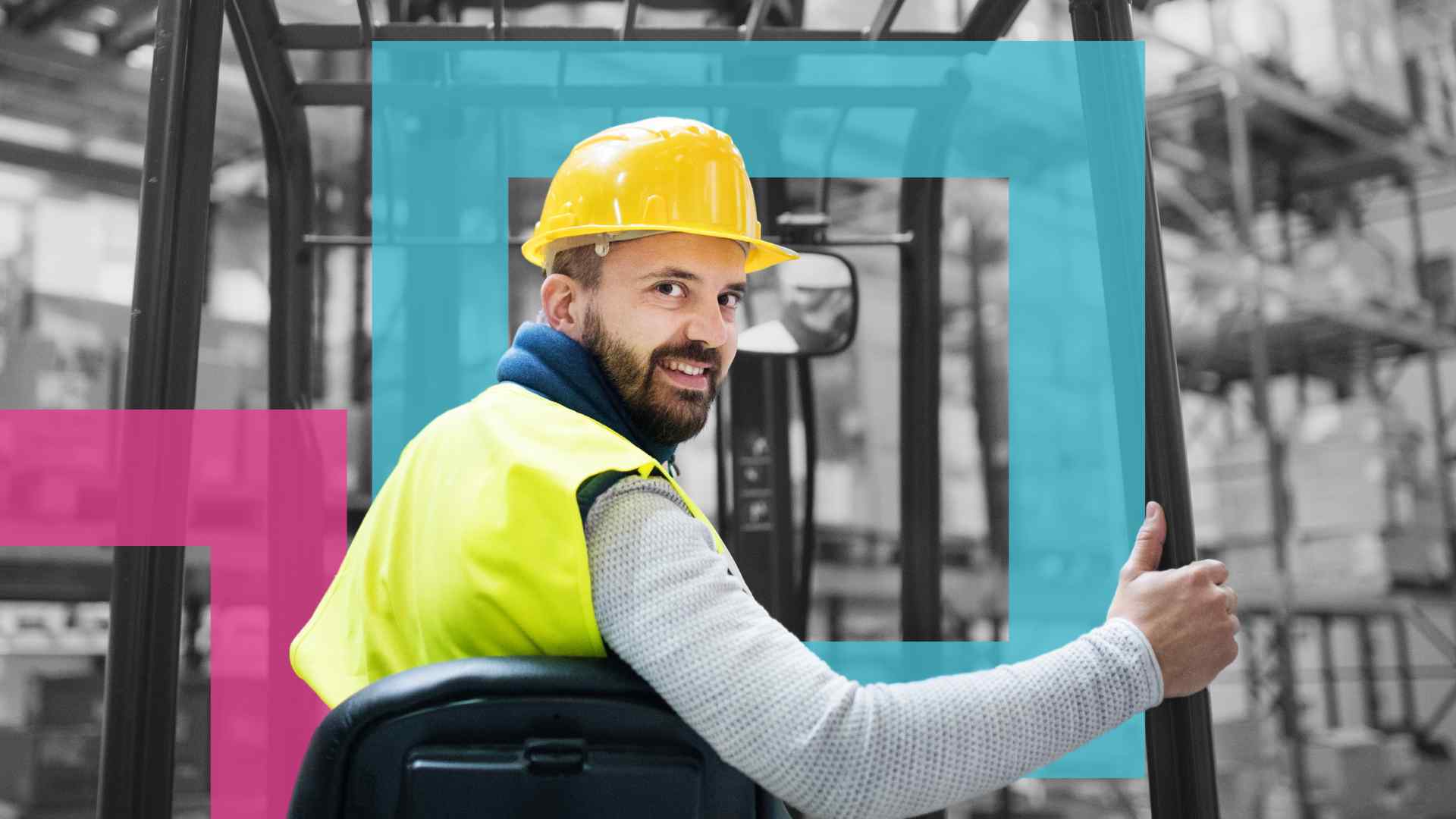 Close up of a man wearing a hi vis vest and hard hat reversing a forklift