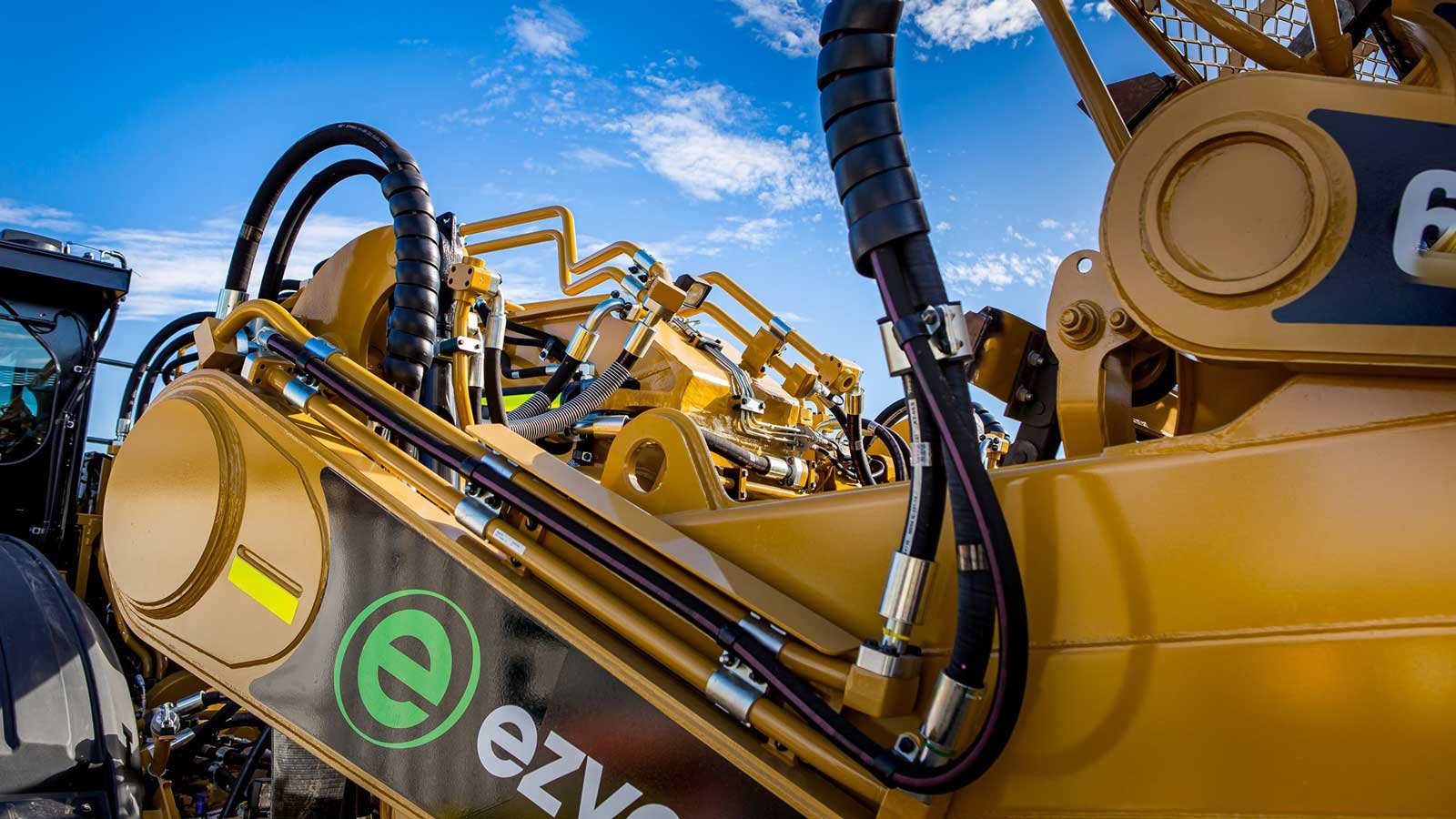 Yellow machine closeup with Ezyquip hire logo