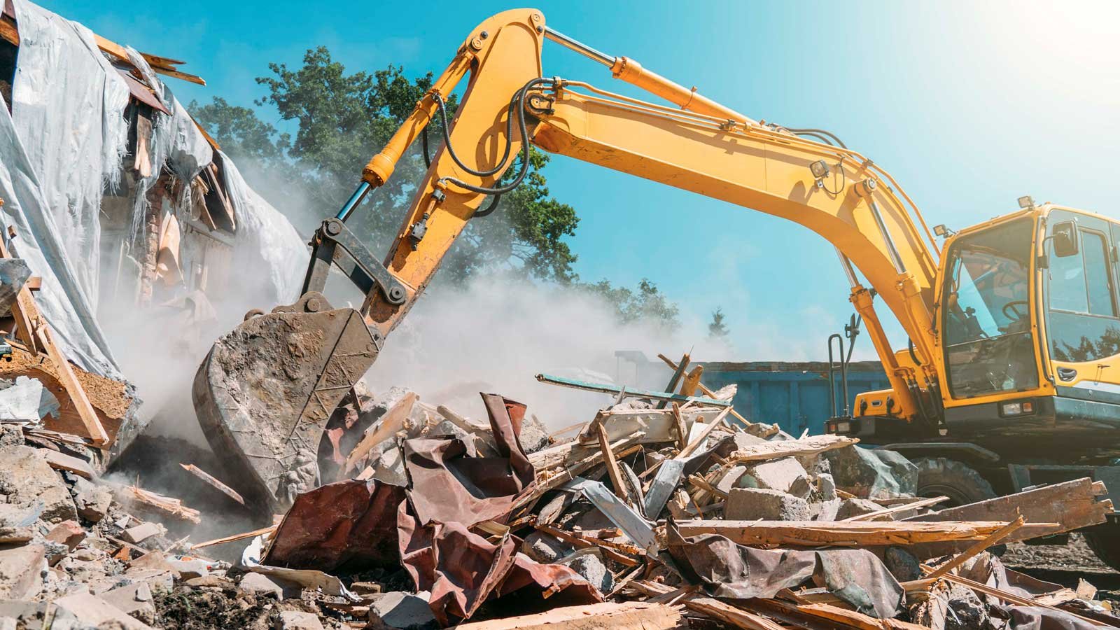 Hydraulic excavator moving rubble