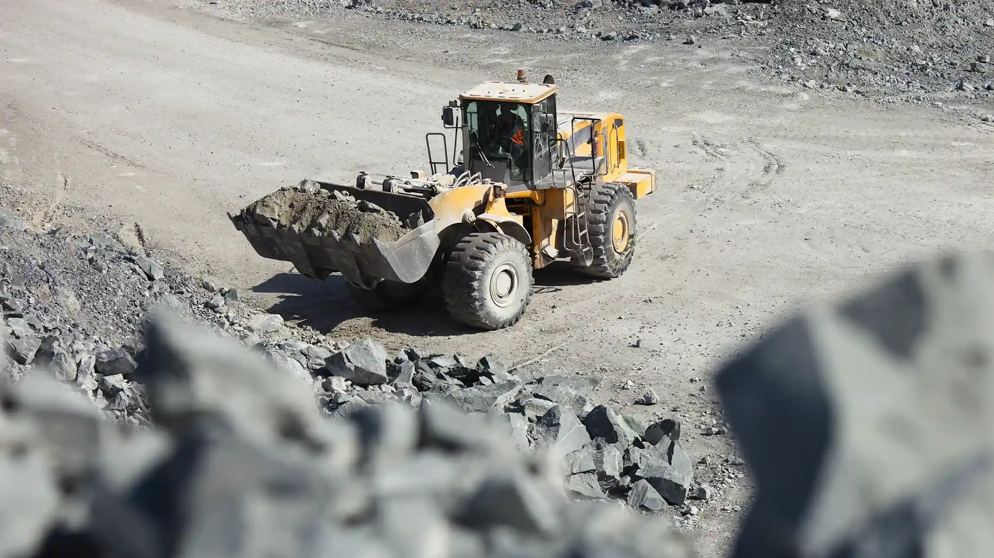 Front loader moving coal in a mine