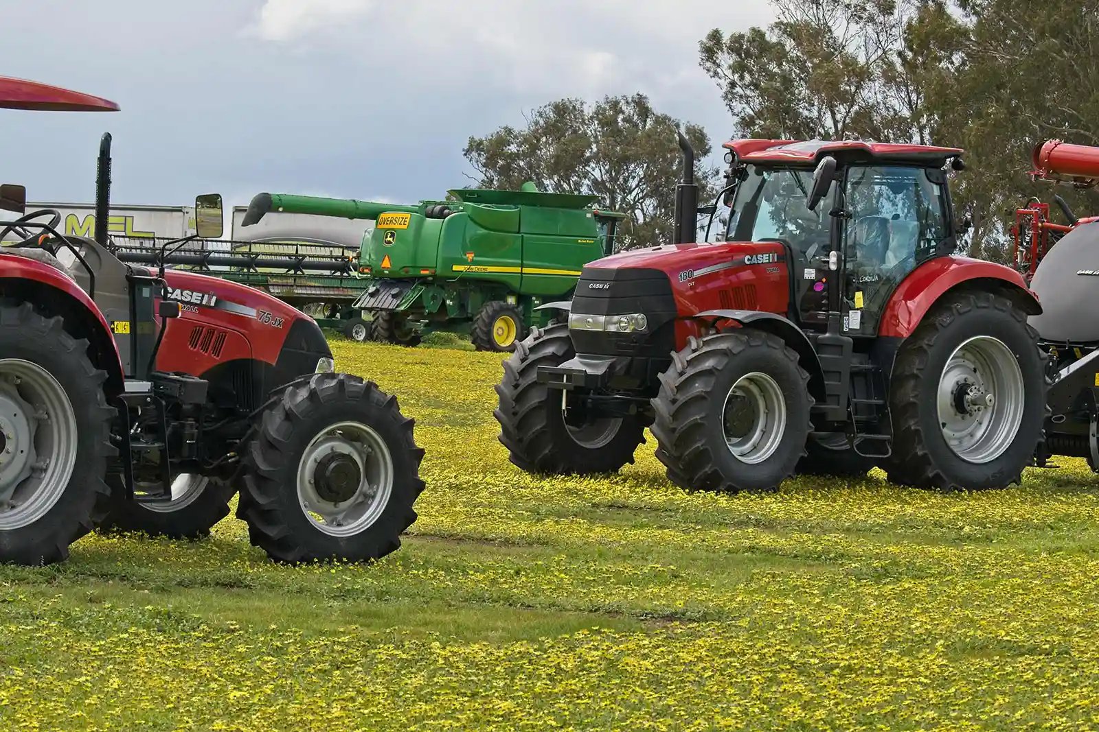Tractors and agricultural equipment at a clearing sale