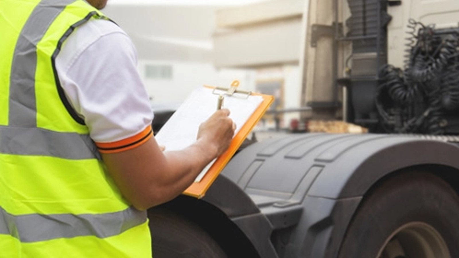 Man doing risk assessment on machinery