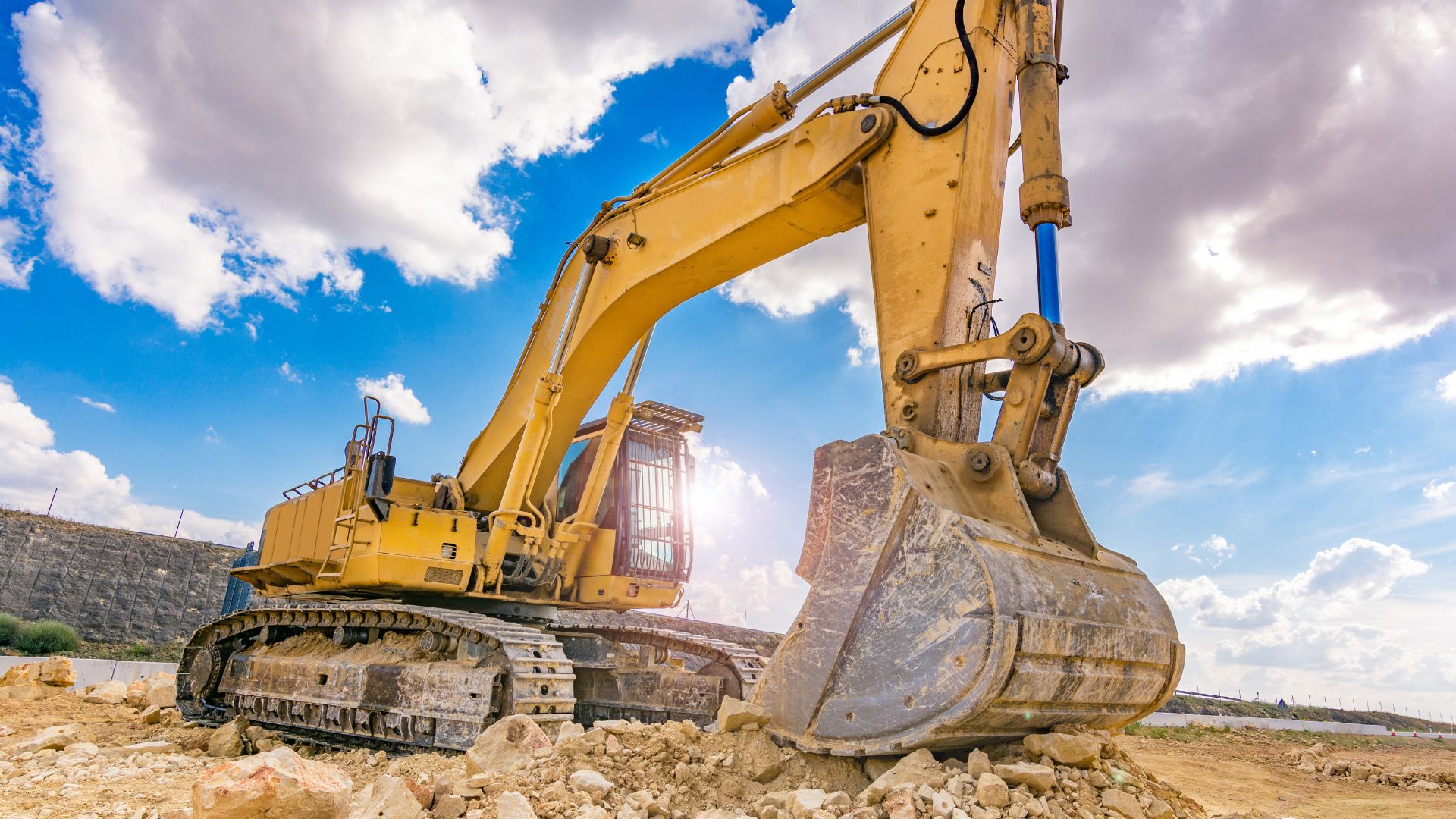 large yellow excavator on a work site