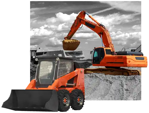 An excavator and bobcat moving dirt into a truck loader on a construction site